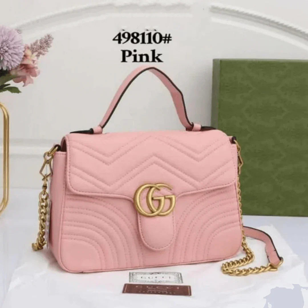 Gucci GG Marmont Pink Handbag with Gold Logo – Stylish Luxury Designer Bag for Women.